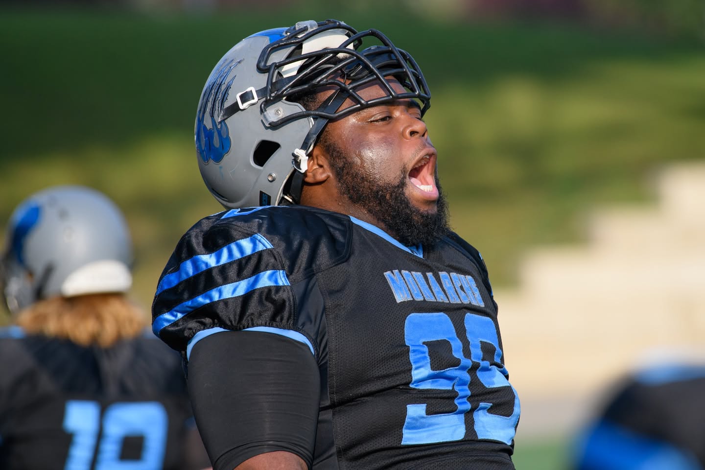 Monarchs defensive lineman fired up on the sideline