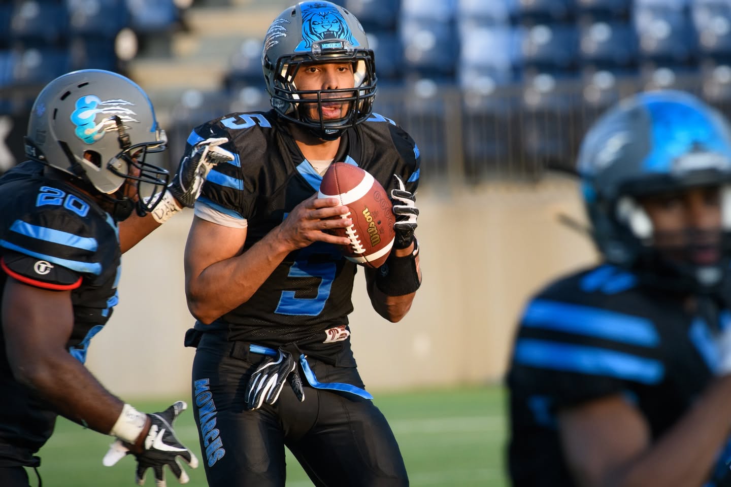 Monarchs quarterback in the pocket vs Cold Lake Fighter Jets