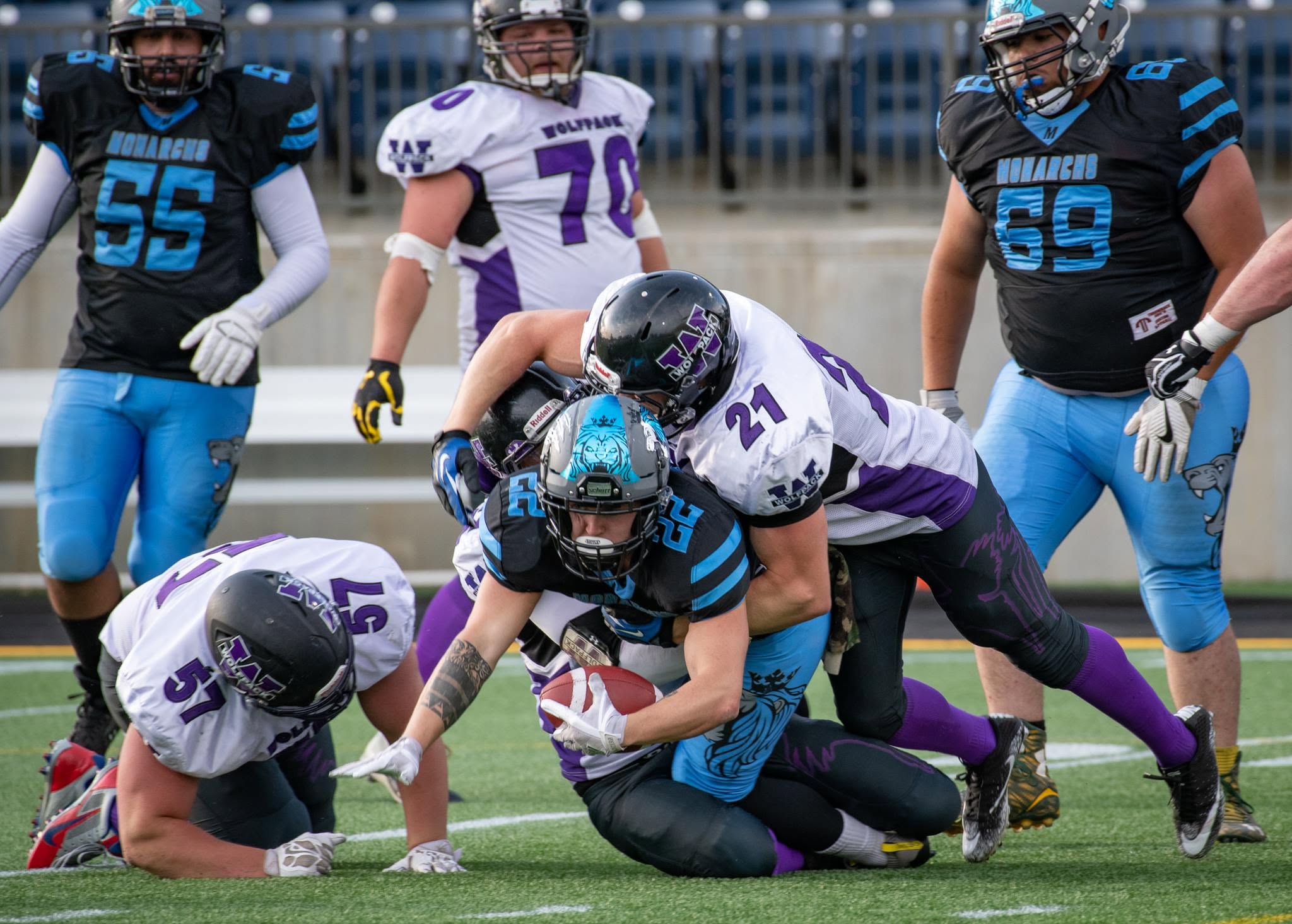 Monarchs runner battling through Wolfpack defenders