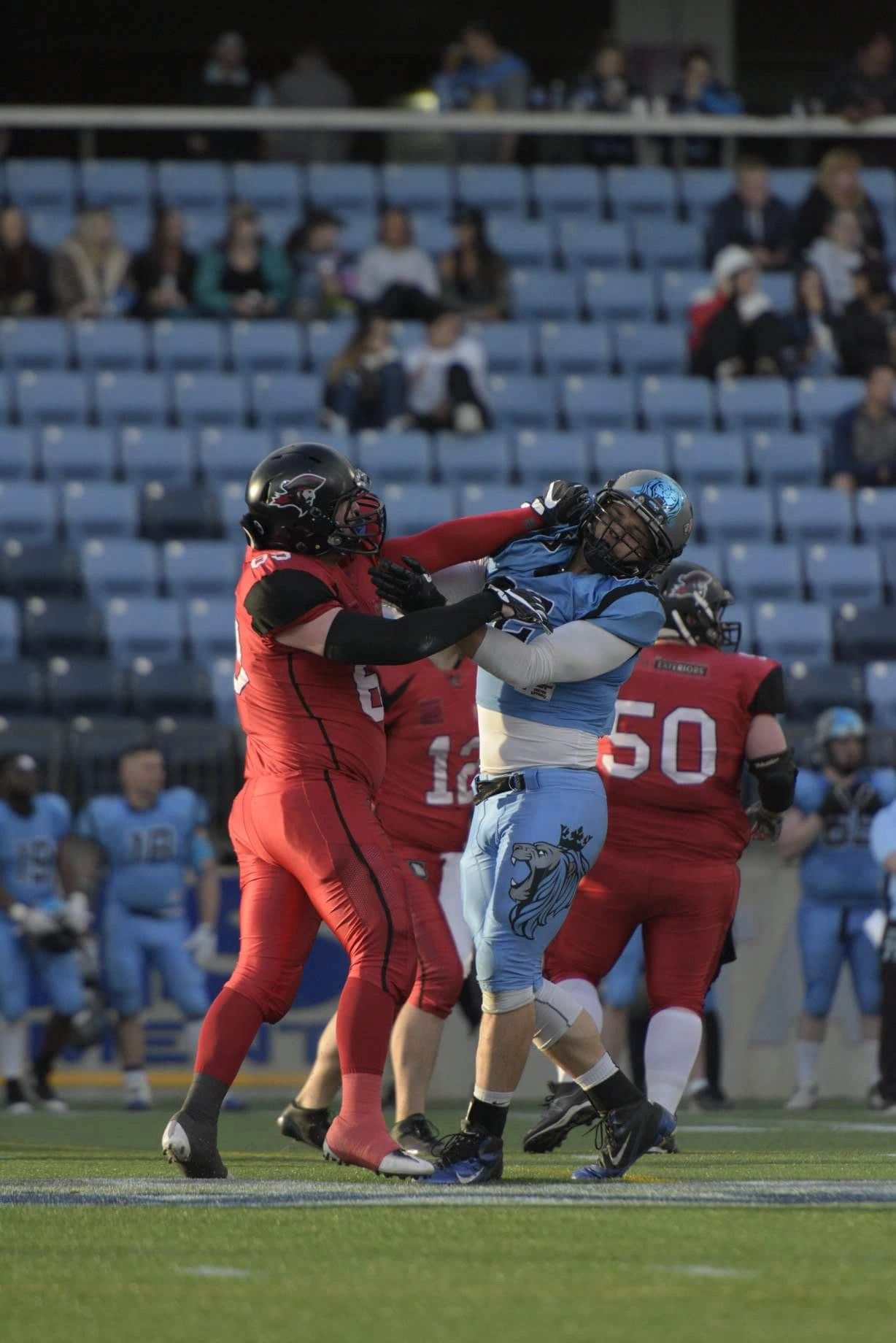Monarchs lineman battling at the line of scrimmage