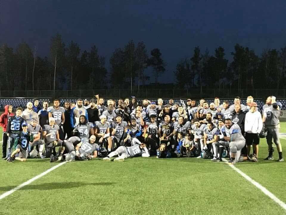Monarchs full team championship photo at dusk