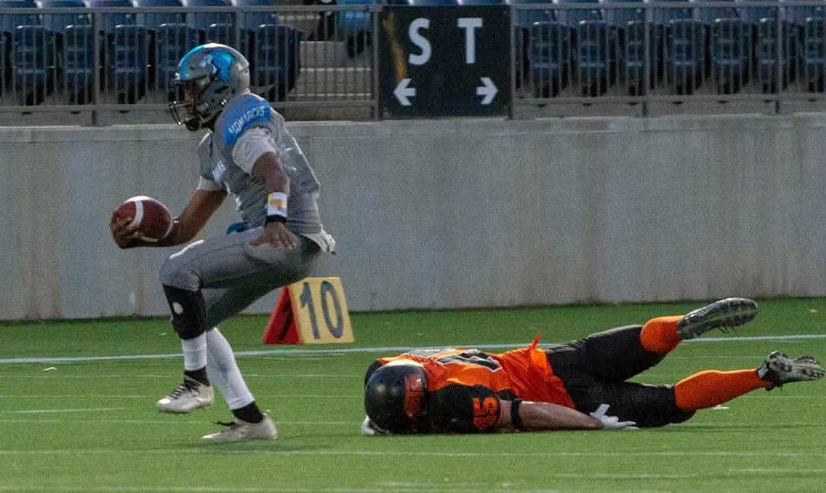 Monarchs ball carrier evading a diving tackle
