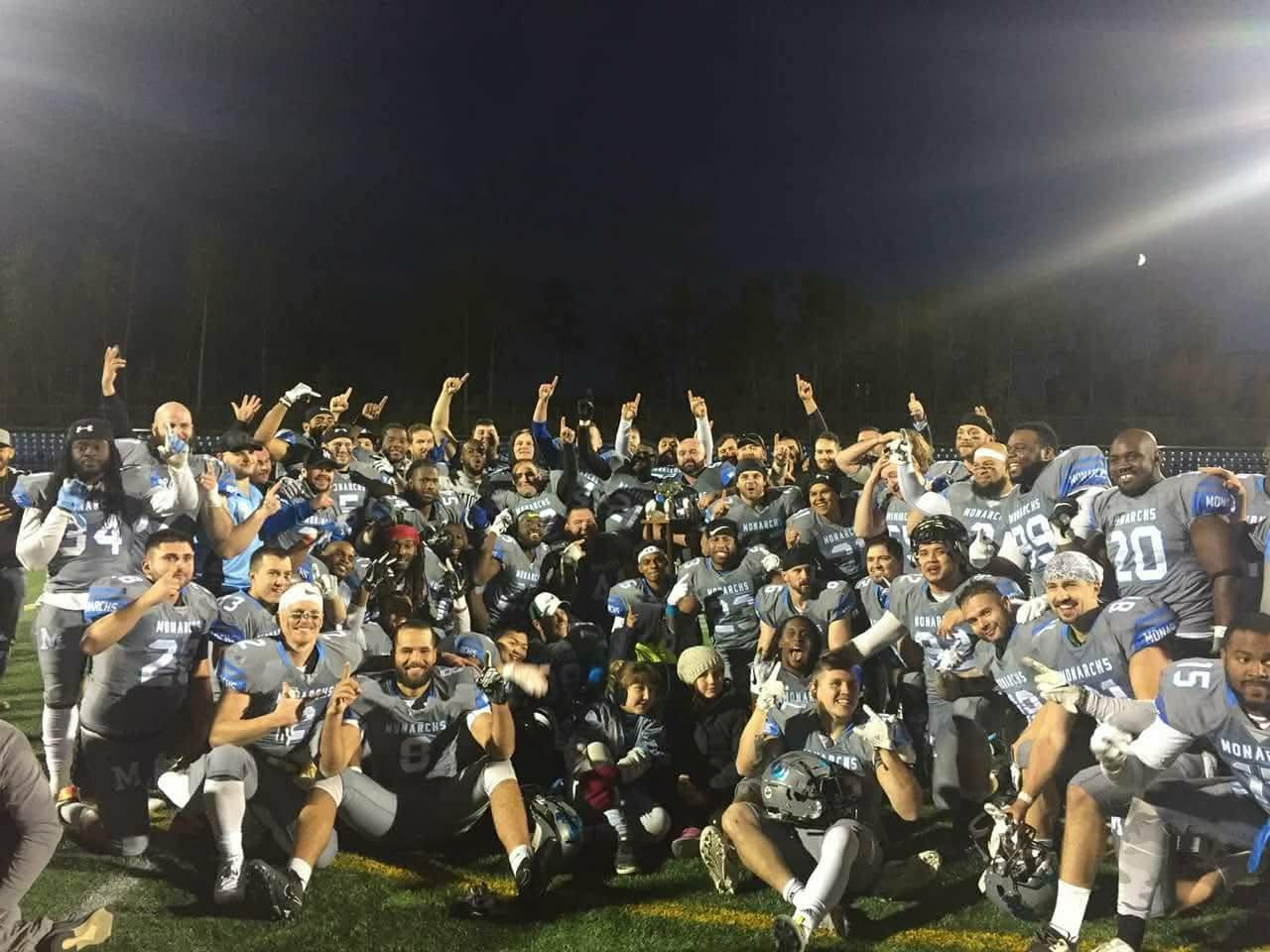 Monarchs full team celebration photo under the lights